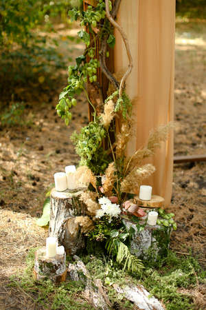 White candles near wedding arch.の写真素材