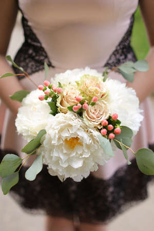 Closeup amazing bouquet of flowers in bride hands.の写真素材