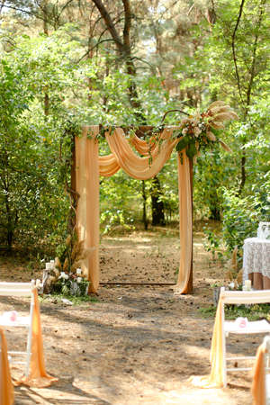Yellow wedding altar in green garden.の写真素材