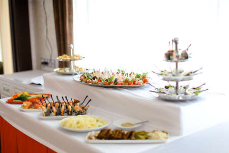 Delicious banquet meals on table with white tablecloth.の写真素材