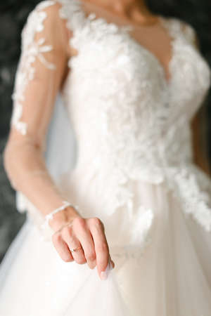Focus on golden ring on bride hand.の写真素材