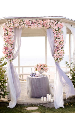 Close up wedding arch decorated by roses.の写真素材
