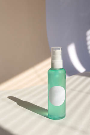 Facial wash cleansing gel, ultra moisturizing cosmetics remover in blue spray bottle.の写真素材