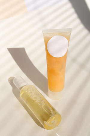 Spray bottle of hair conditioner ,lotion and facial cream in light background with copy space.の写真素材