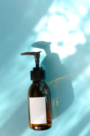 Natural skincare cosmetics, creams and oils on blue background. Plant-based beauty products.の写真素材