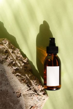 Eco friendly Bottles and jars with natural skincare cosmetics, creams or oils on light background. Plant-based beauty productsの写真素材
