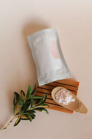 Ancient minerals - green tea clay powder and mud mask for spa, beauty concept with wooden spoonの写真素材