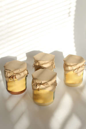 four jars of raw fresh peanut butterの写真素材