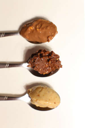 Spoons with Peanut Cashews Almond Butterの写真素材