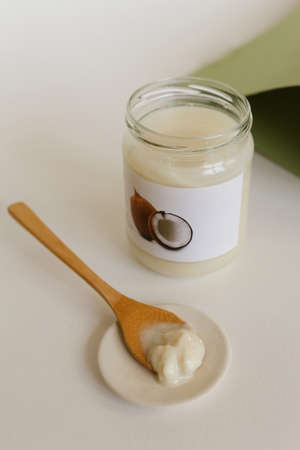 Natural coconut oil and coconuts open jar