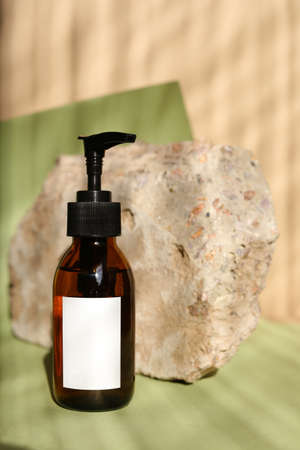 Eco friendly Bottles and jars with natural skincare cosmetics, creams or oils on light background. Plant-based beauty productsの写真素材