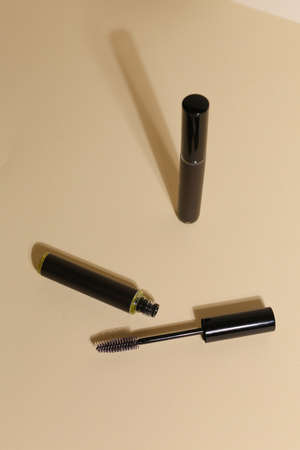 Isolated mascara on neutral backfround. Open with brush, black