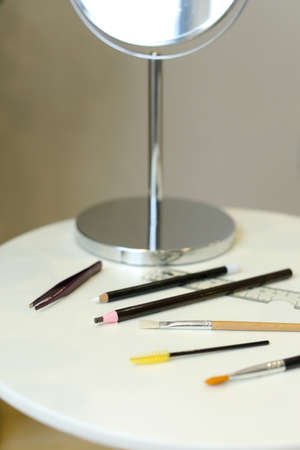 Set of professional cosmetic: make-up brushes, lipstick and brow pencilの写真素材