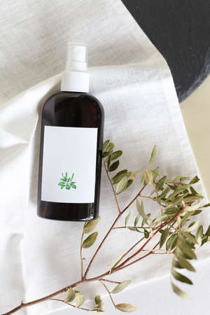 Eco friendly Bottle or jar with natural skincare cosmetics, creams or oils on light background. Plant-based beauty productsの写真素材