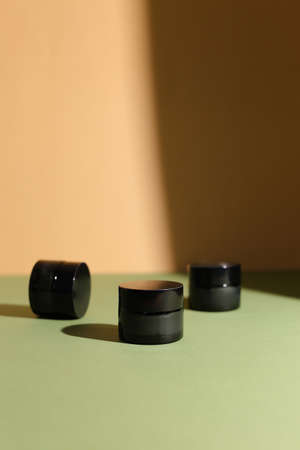A few beauty hygiene glass jars on neutral backgroundの写真素材