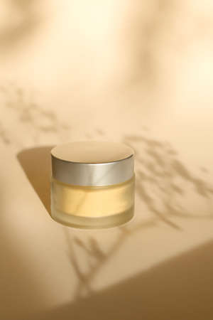 glass jars beauty hygiene products on beige backgroundの写真素材