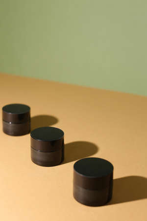 A few beauty hygiene Amber glass jars on neutral backgroundの写真素材