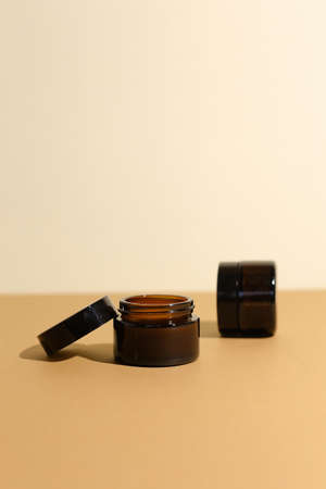 A few beauty hygiene Amber glass jars on neutral backgroundの写真素材