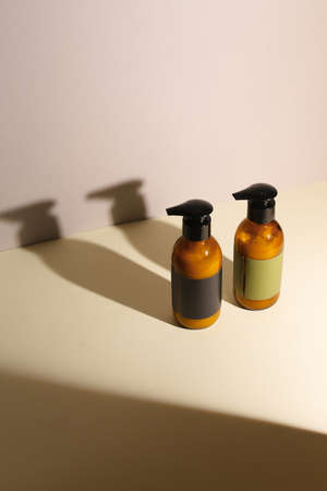Amber glass dispenser bottle, sprayer and moisturizer cream jar. Natural cosmetic products packaging design template, brandingの写真素材