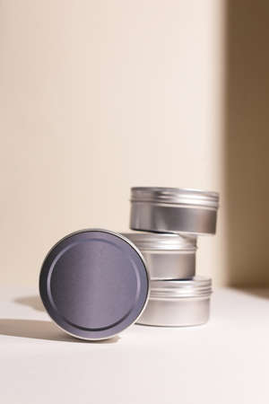 Aluminum round jar for cosmetics. Metalic cosmetic bottles. Blank mock up advertising container with copy space.の写真素材