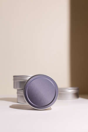 Aluminum round jar for cosmetics. Metalic cosmetic bottles. Blank mock up advertising container with copy space.の写真素材