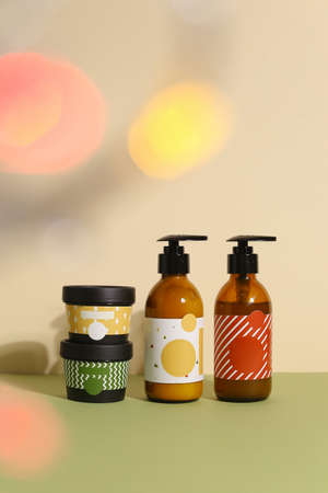 Beauty natural skincare products development concept. Dermatologist cosmetic skincare bottle with pump dispenser and organic ingredient on neutral background.の写真素材
