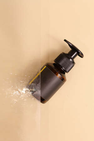 Beauty natural skincare products development concept. Dermatologist cosmetic skincare bottle with pump dispenser and organic ingredient on neutral background.の写真素材
