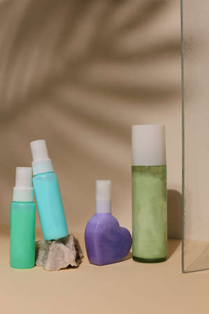 Eco friendly Bottle and tube with natural skincare cosmetics, creams or oils on light background. Plant-based beauty productsの写真素材
