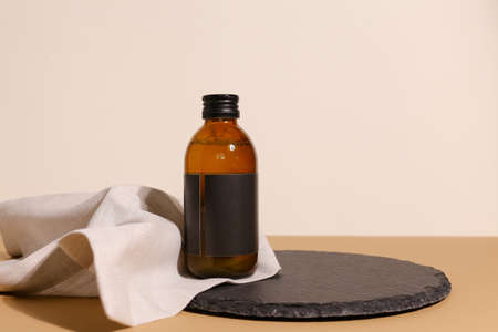 Amber glass dispenser bottle, sprayer and moisturizer cream jar. Natural cosmetic products packaging...