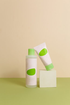 Eco friendly Bottle and tube with natural skincare cosmetics, creams or oils on light background. Plant-based beauty productsの写真素材