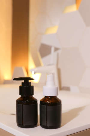 Amber glass dispenser bottle, sprayer and moisturizer cream jar. Natural cosmetic products packaging design template, brandingの写真素材