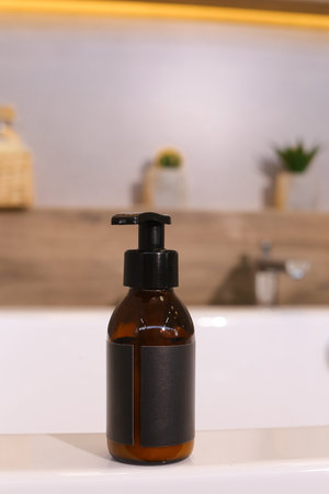 Amber glass dispenser bottle, sprayer and moisturizer cream jar. Natural cosmetic products packaging design template, brandingの写真素材
