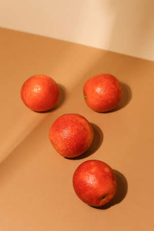 Juicy dark tangerines on light background. Tasty fruits. Focus on front tangerine.の写真素材