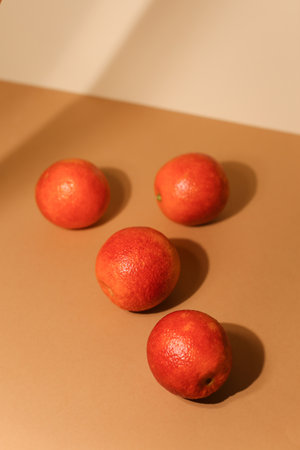 Juicy dark tangerines on light background. Tasty fruits. Focus on front tangerine.の写真素材