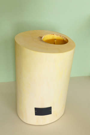 Wooden candle holder rustic interior centerpiece with candles in a cozy barn setting.の写真素材