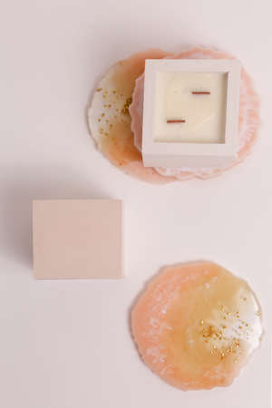scented candles on off white background in rock holderの写真素材