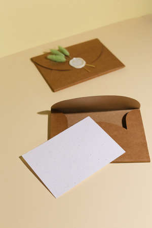 Brown Envelope with empty letter for yur text on beige background