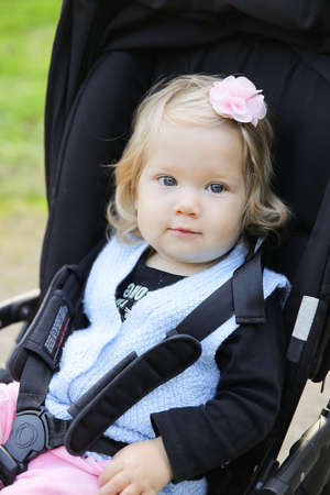 A cute canadian baby girl looking up at the camera. Vertical shot.の写真素材