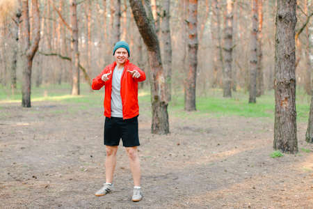 Young boy running in park at morning.の写真素材