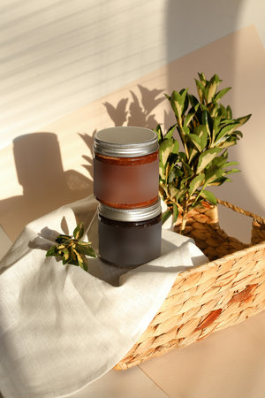plastic jar with cream and lid isolated on neutral light background. Beauty spa and taking care of skin productの写真素材