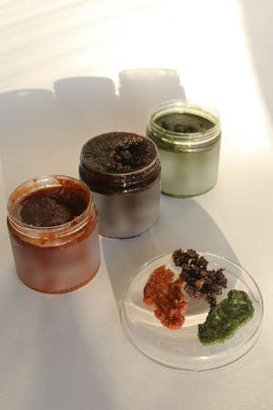 plastic jar with cream and lid isolated on neutral light background. Beauty spa and taking care of skin productの写真素材