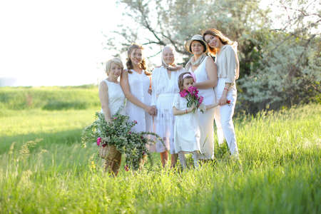 American granny standing with daughters, granddaughters and grand granddaughter outside.の写真素材