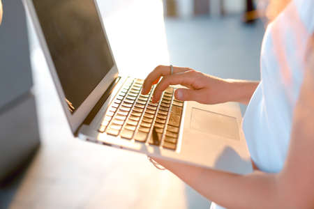 Hand business woman press touchpad keyboard laptopの写真素材