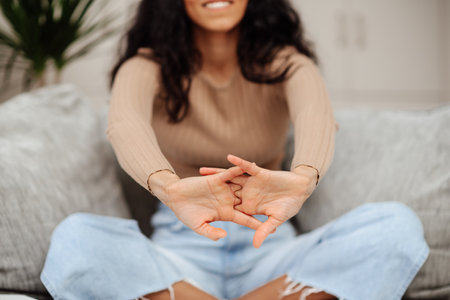 Arab women are turning their wrists and shaking off their wrists in physical therapy to reduce work-related aches and painsの写真素材