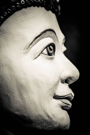 Buddha portrait isolated on black; monochromeの写真素材