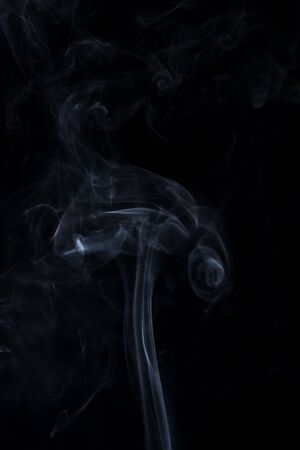 white smoke on black backgroundの写真素材