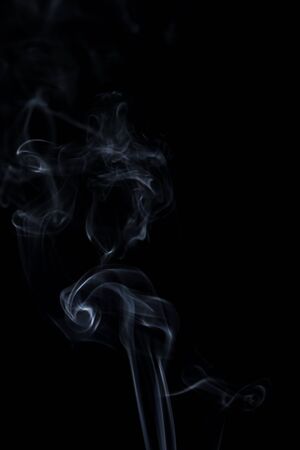 white smoke on black backgroundの写真素材