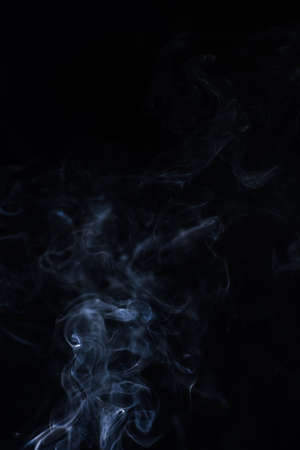 white smoke on black backgroundの写真素材