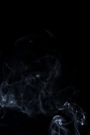 white smoke on black backgroundの写真素材