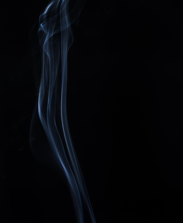 white smoke on black backgroundの写真素材